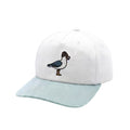 A white baseball cap with a light blue brim, featuring an embroidered duckling design on the front.