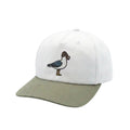 A structured baseball cap with a white crown and an olive green curved brim, featuring an embroidered bird design on the front.