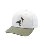 A structured baseball cap with a white crown and an olive green curved brim, featuring an embroidered bird design on the front.